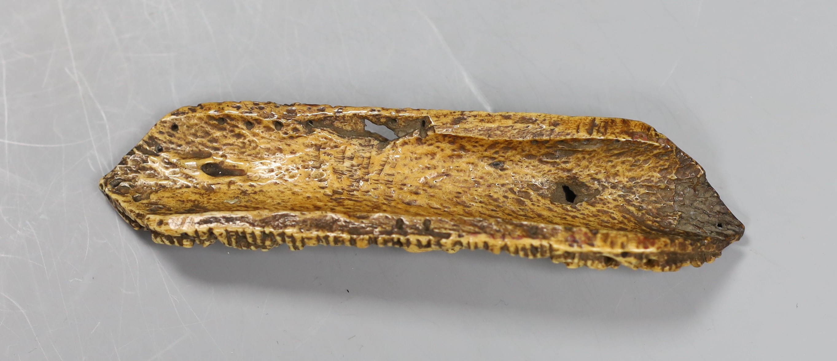 A 19th century Burmese bone carving of a Buddhist deity, 15cm tall